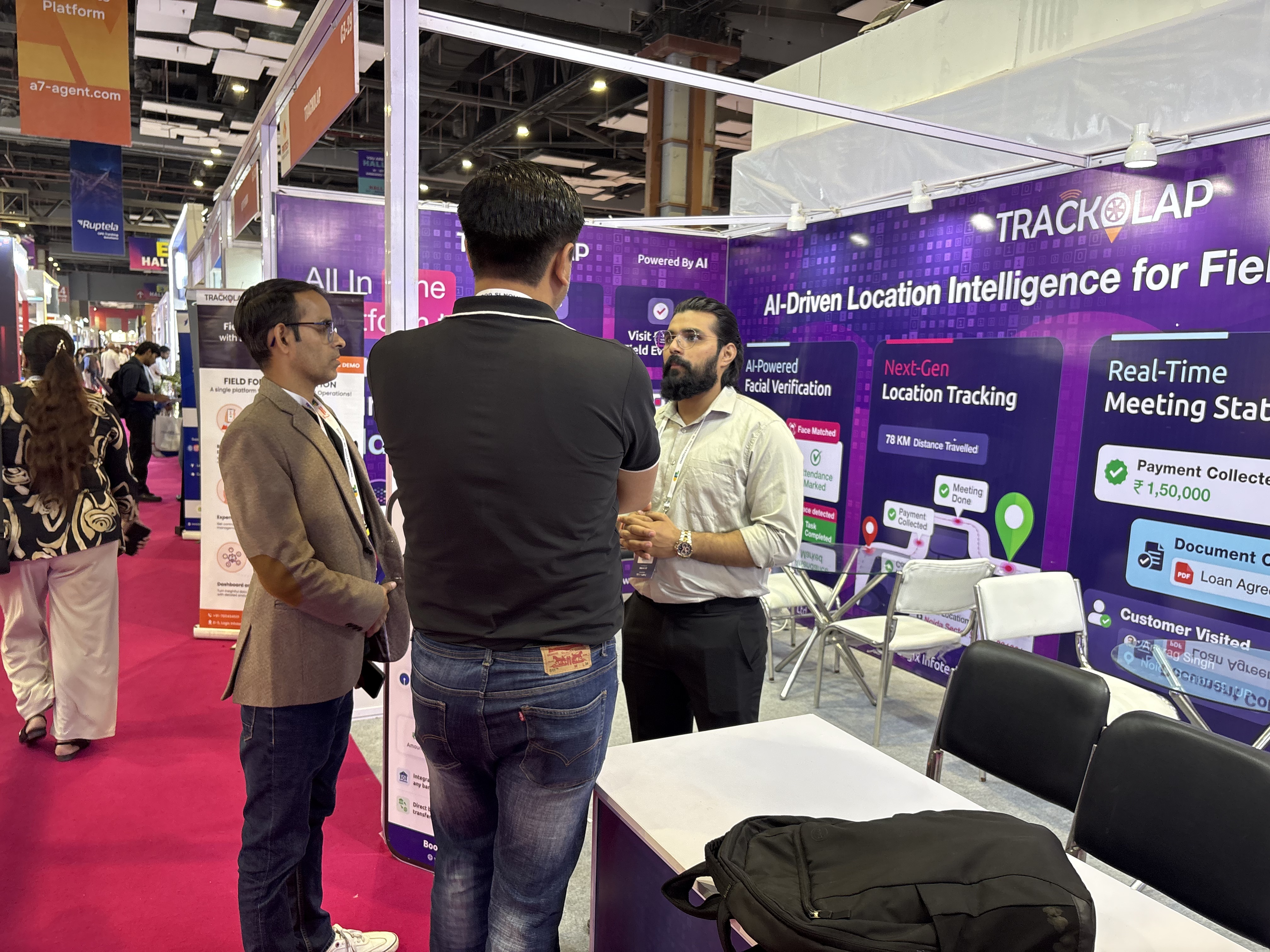 TrackOlap team discussing AI workforce management with visitors at Fintech India Expo 2026