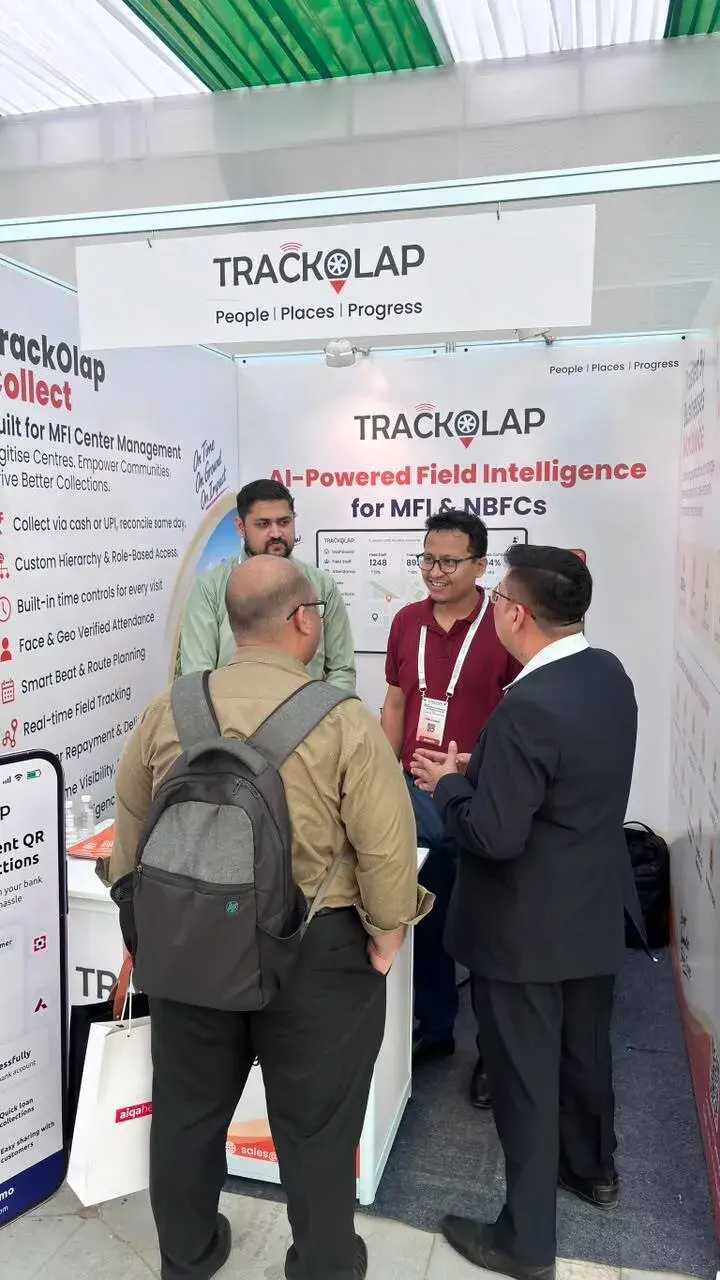 Visitors talking with the TrackOlap team at the Sa-Dhan 2026 booth