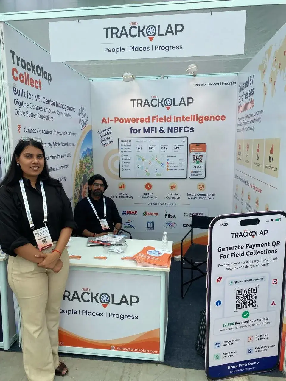 TrackOlap Collect and Payment QR displays at the Sa-Dhan 2026 booth