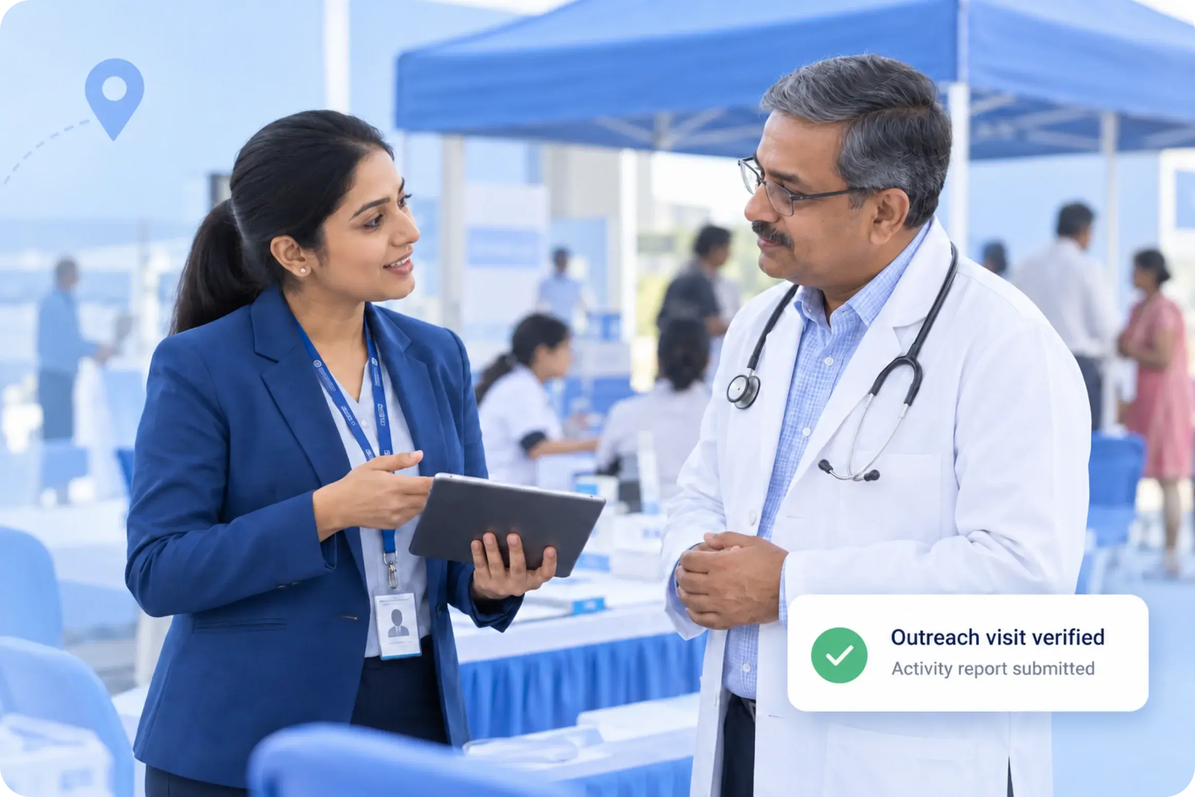 Hospital outreach representative discusses a health camp with a doctor and records a verified outreach visit